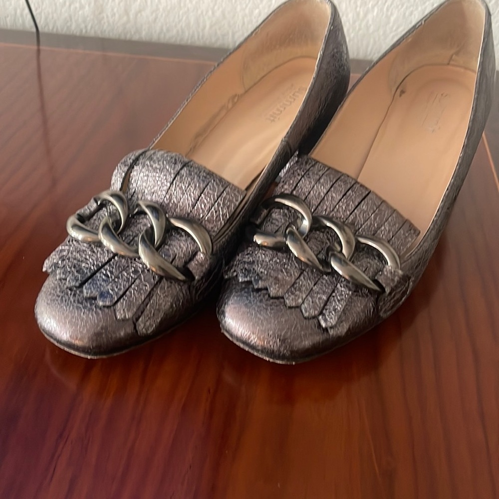 Loafers with a 1” heel and decorative chain across the toe. Worn once.